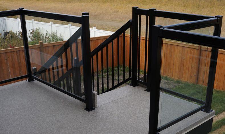 Black railings with posts, spindles and tempered glass